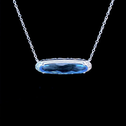 4.21 ctw blue topaz and diamond pendant