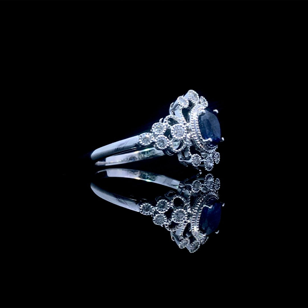 164144 - .65 ctw sapphire and diamond ring