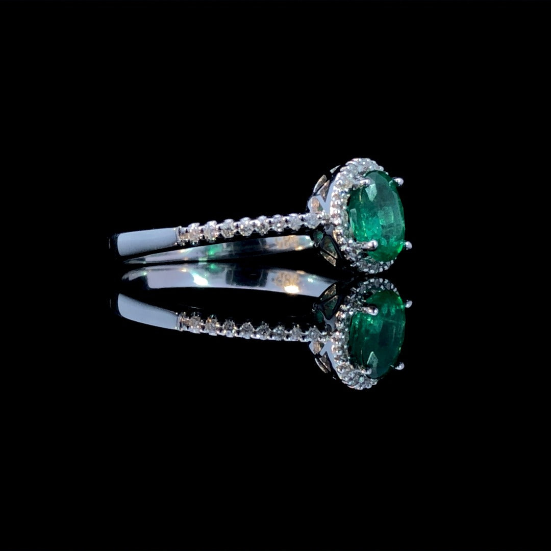 163300 - .64 ctw diamond and emerald ring