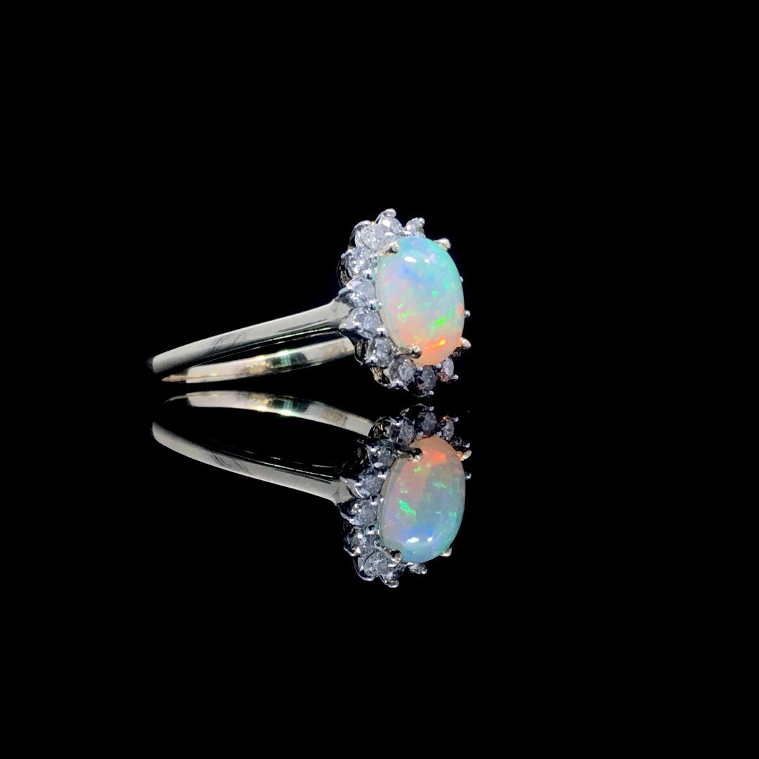 164135 - .60 ctw opal and diamond ring