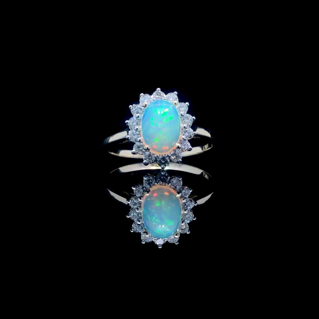 164135 - .60 ctw opal and diamond ring