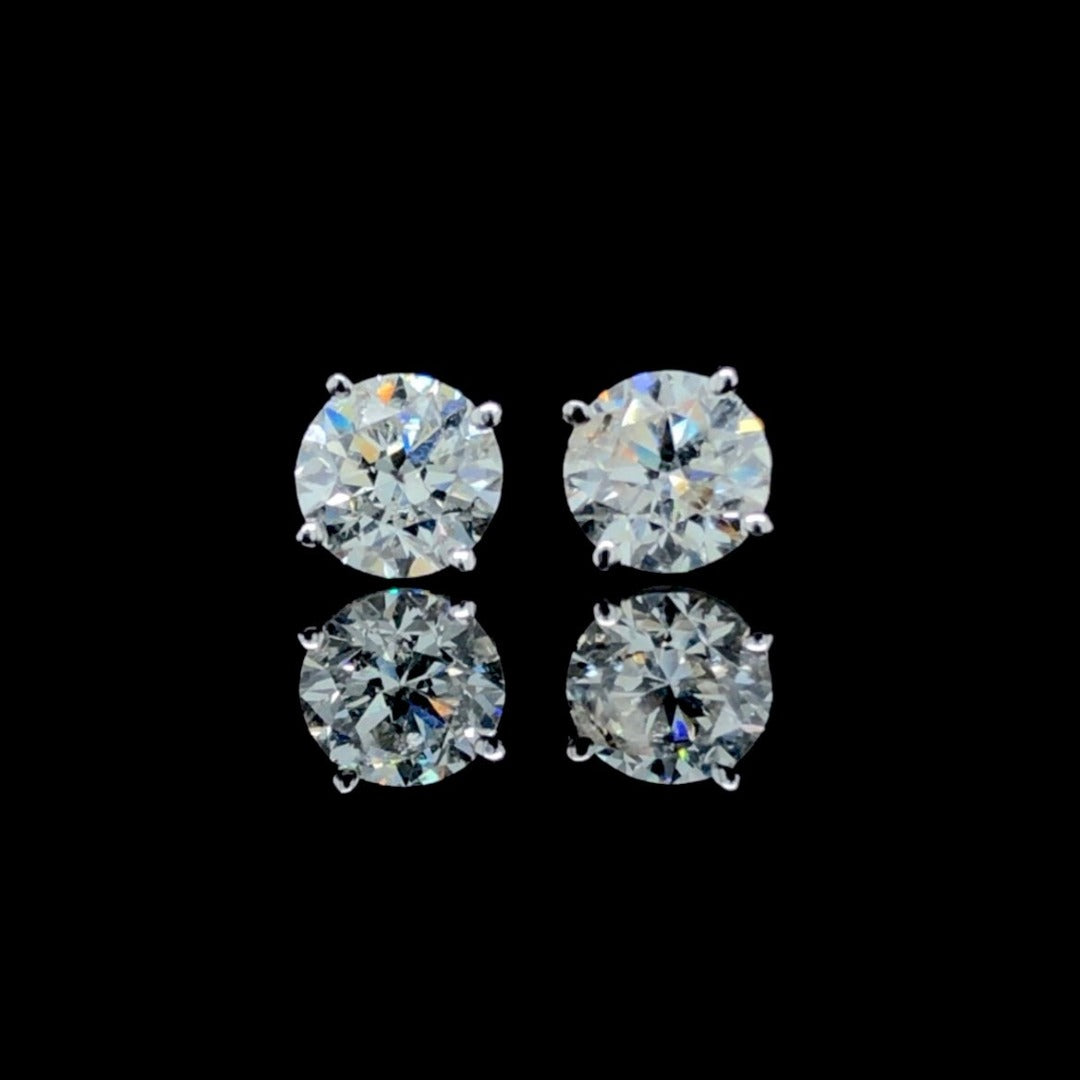 157032 - 1.18 ctw diamond studs
