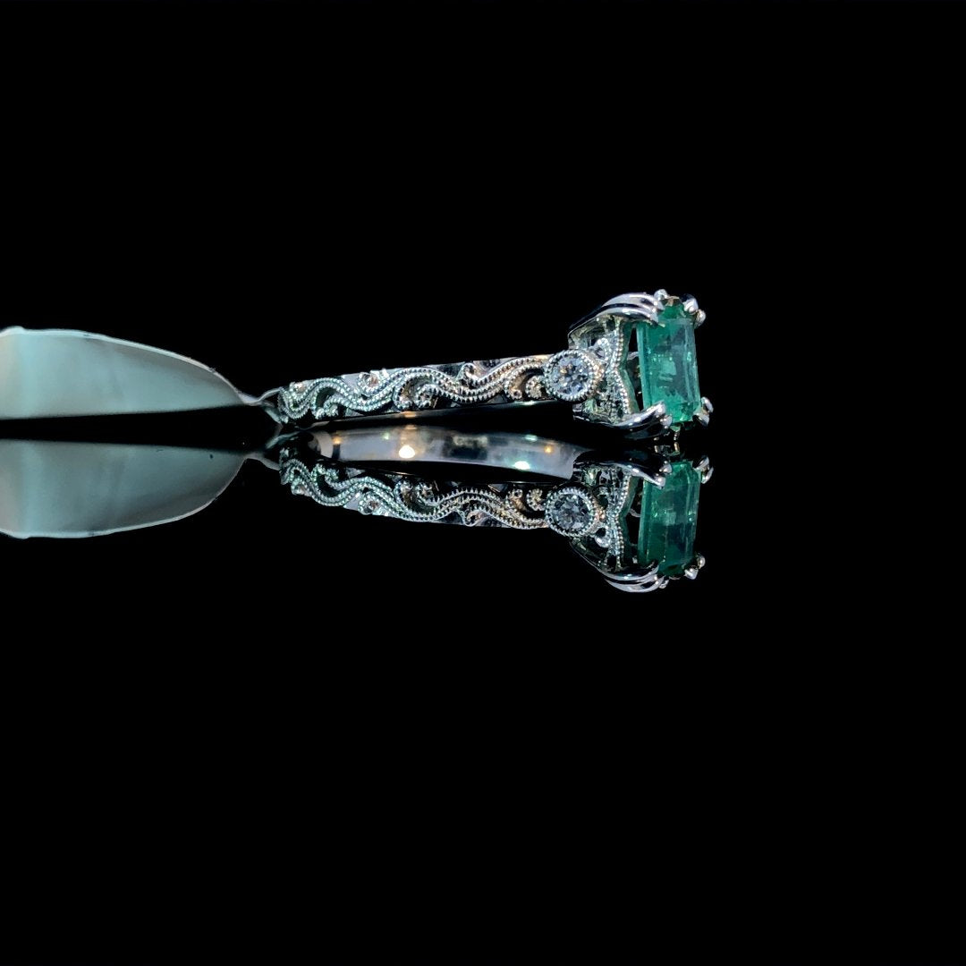 162889 - .56 ctw emerald and diamond ring