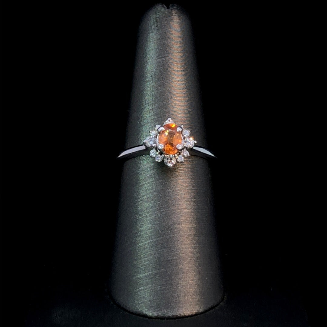159585 - .22 ctw spessartite garnet and diamond ring