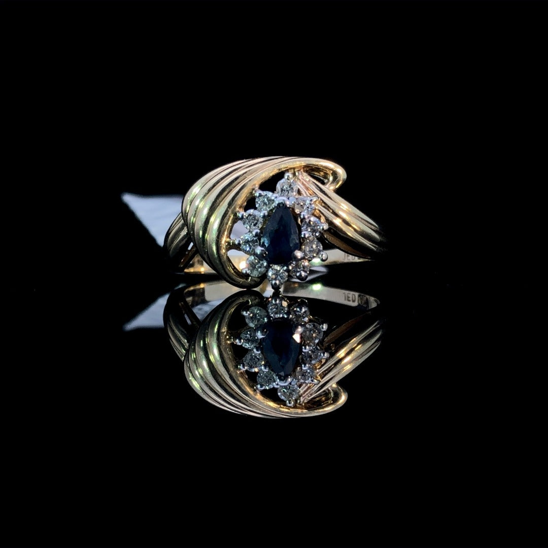 115326 - .20 ctw diamond and 3x5 mm sapphire ring
