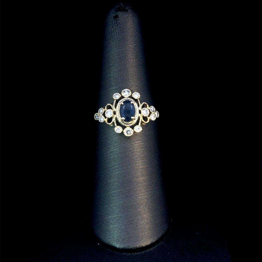 164145 - .65 ctw sapphire and diamond ring