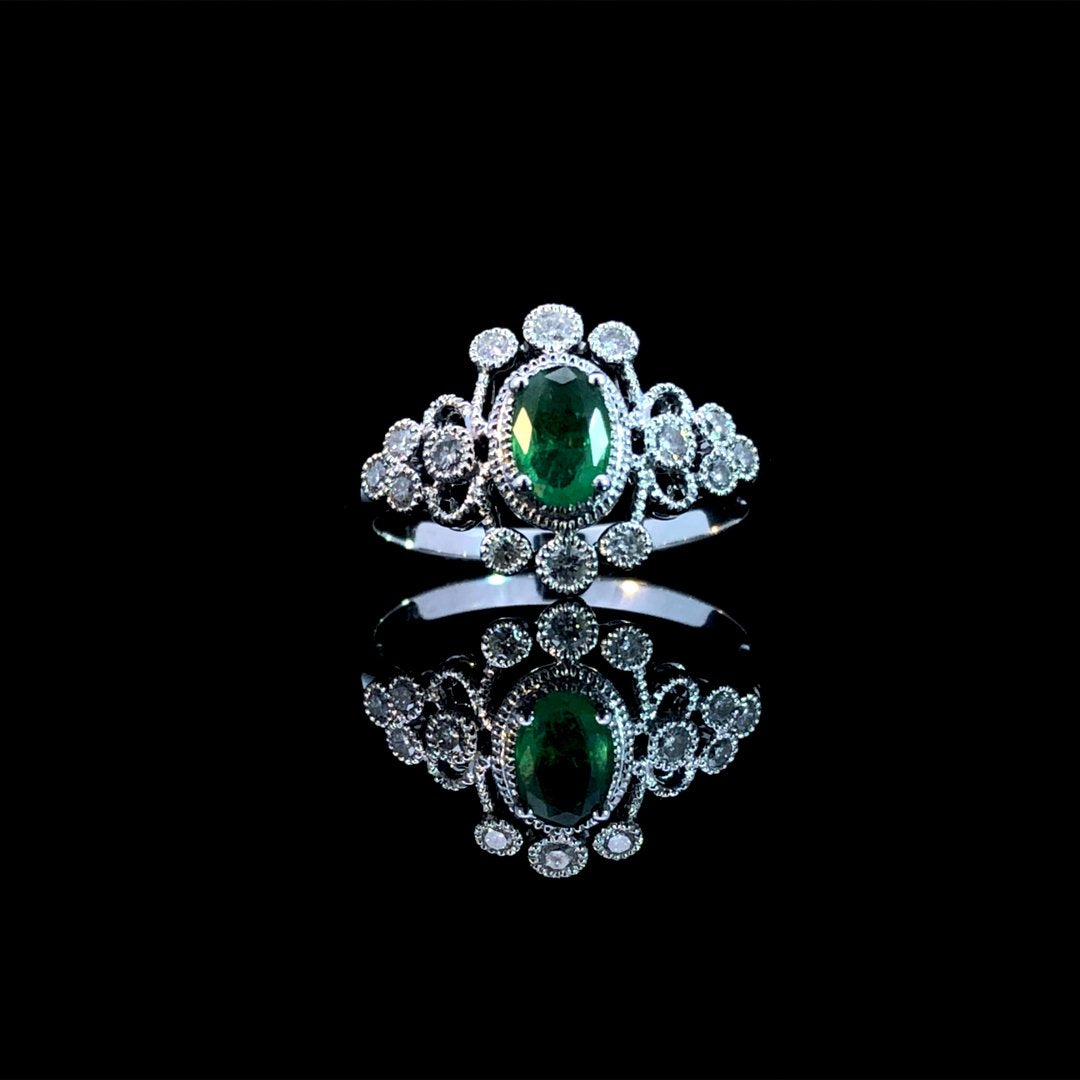 164142 - .65 ctw emerald and diamond ring