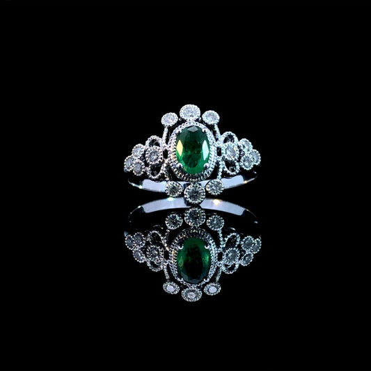 164142 - .65 ctw emerald and diamond ring