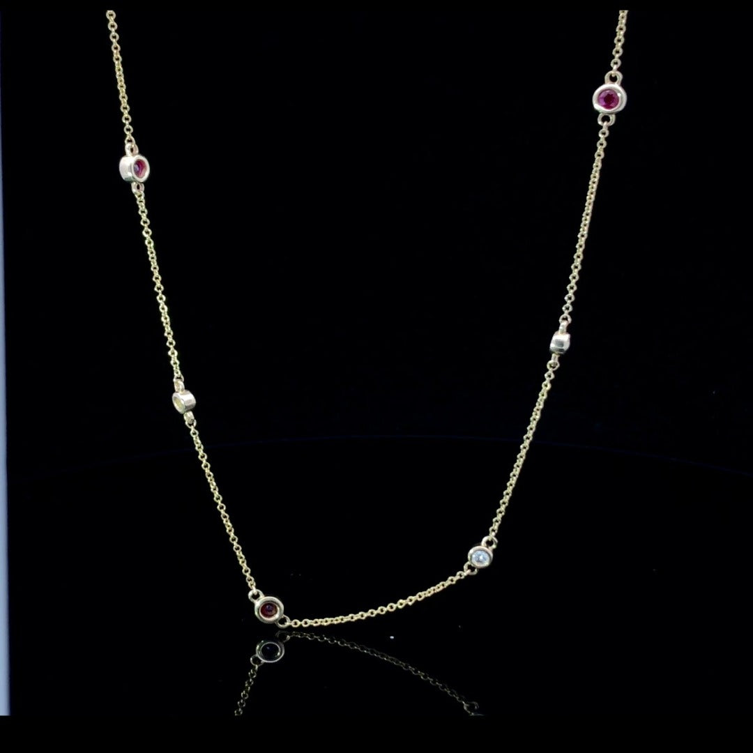 158113 - .24 ctw diamond and ruby necklace