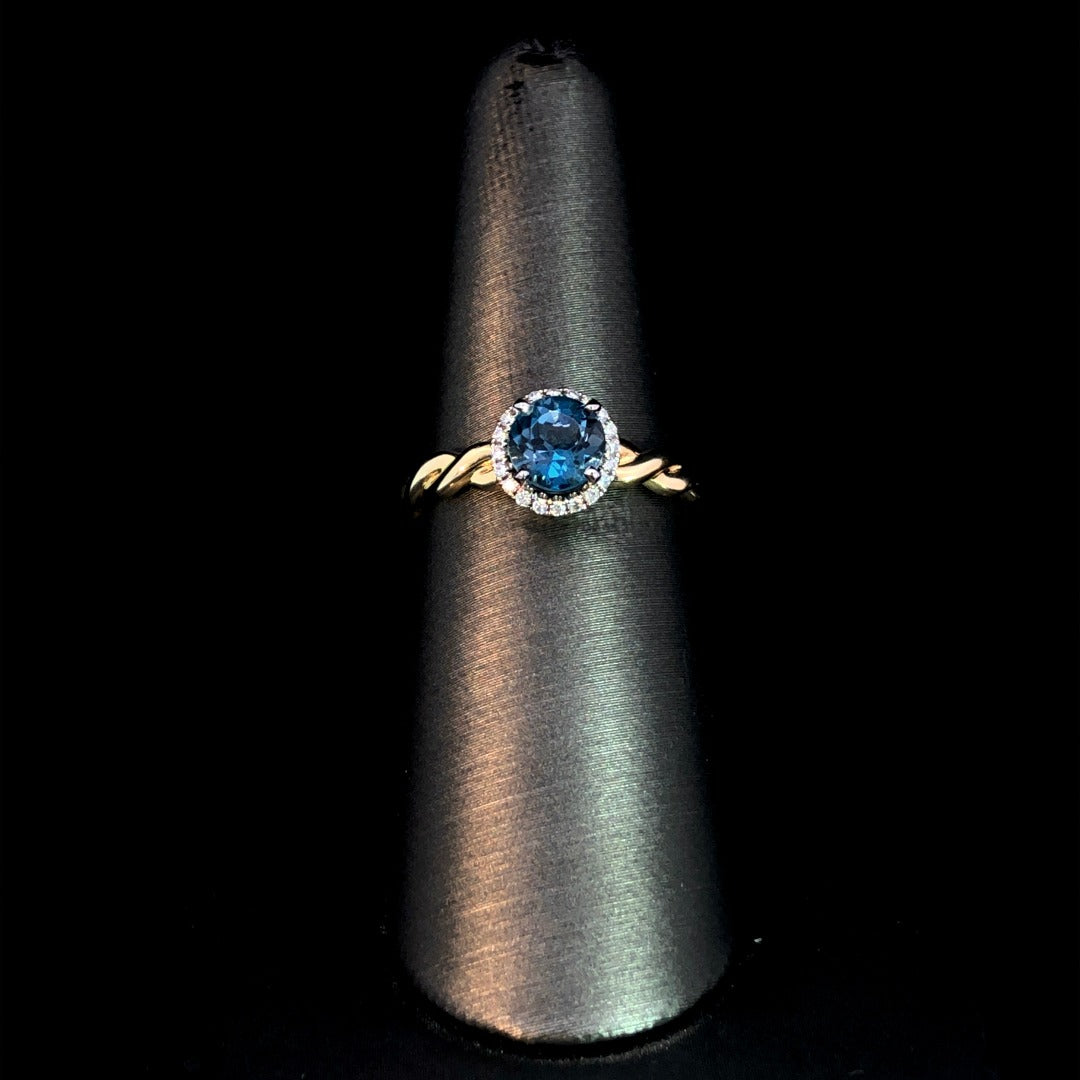 162890 - .08 ctw blue topaz and diamond ring