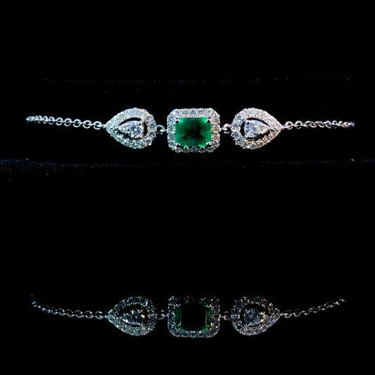 163719 - .80 ctw diamond and emerald bracelet