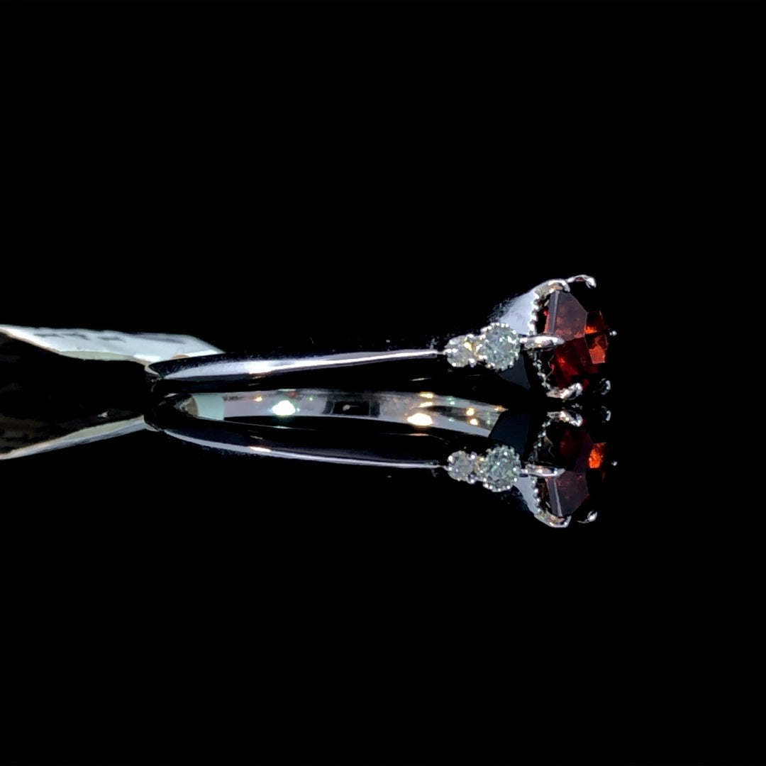 163351 - .70 ctw garnet and diamond ring