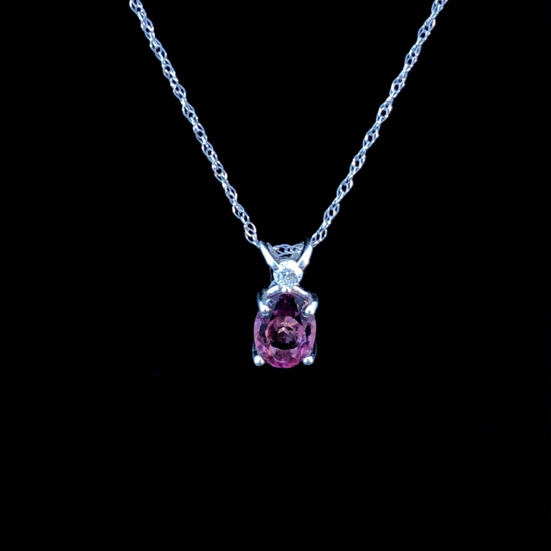 133698 - .06 ctw diamond and ruby pendant