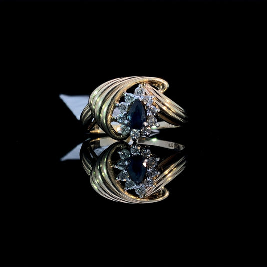 115326 - .20 ctw diamond and 3x5 mm sapphire ring