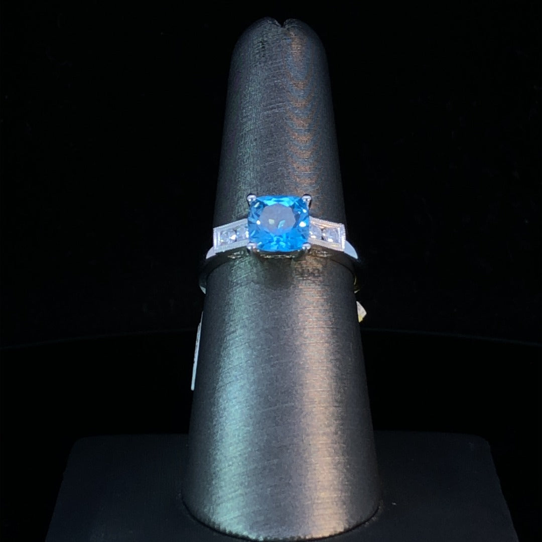 155521 - .15 ctw blue topaz and diamond ring