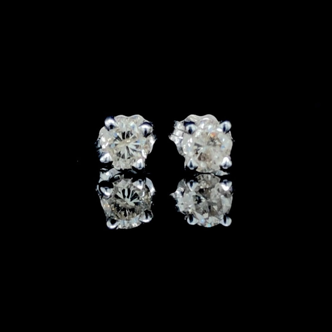 .57 ctw diamond stud earrings