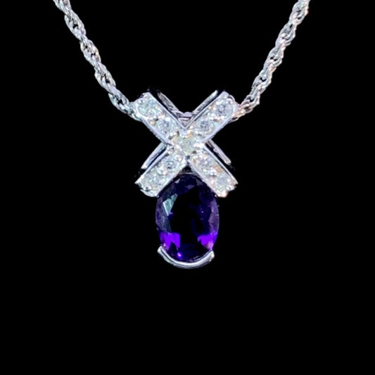 142609 - .09 ctw diamond and amethyst pendant