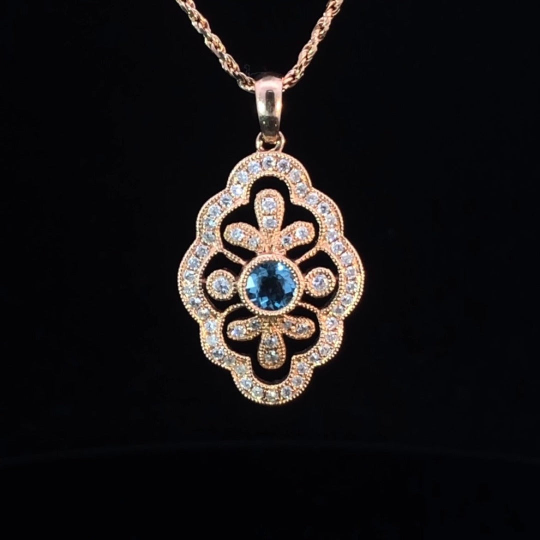 .63 ctw blue topaz and diamond pendant