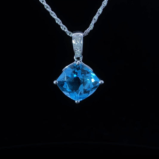 Blue topaz and diamond pendant