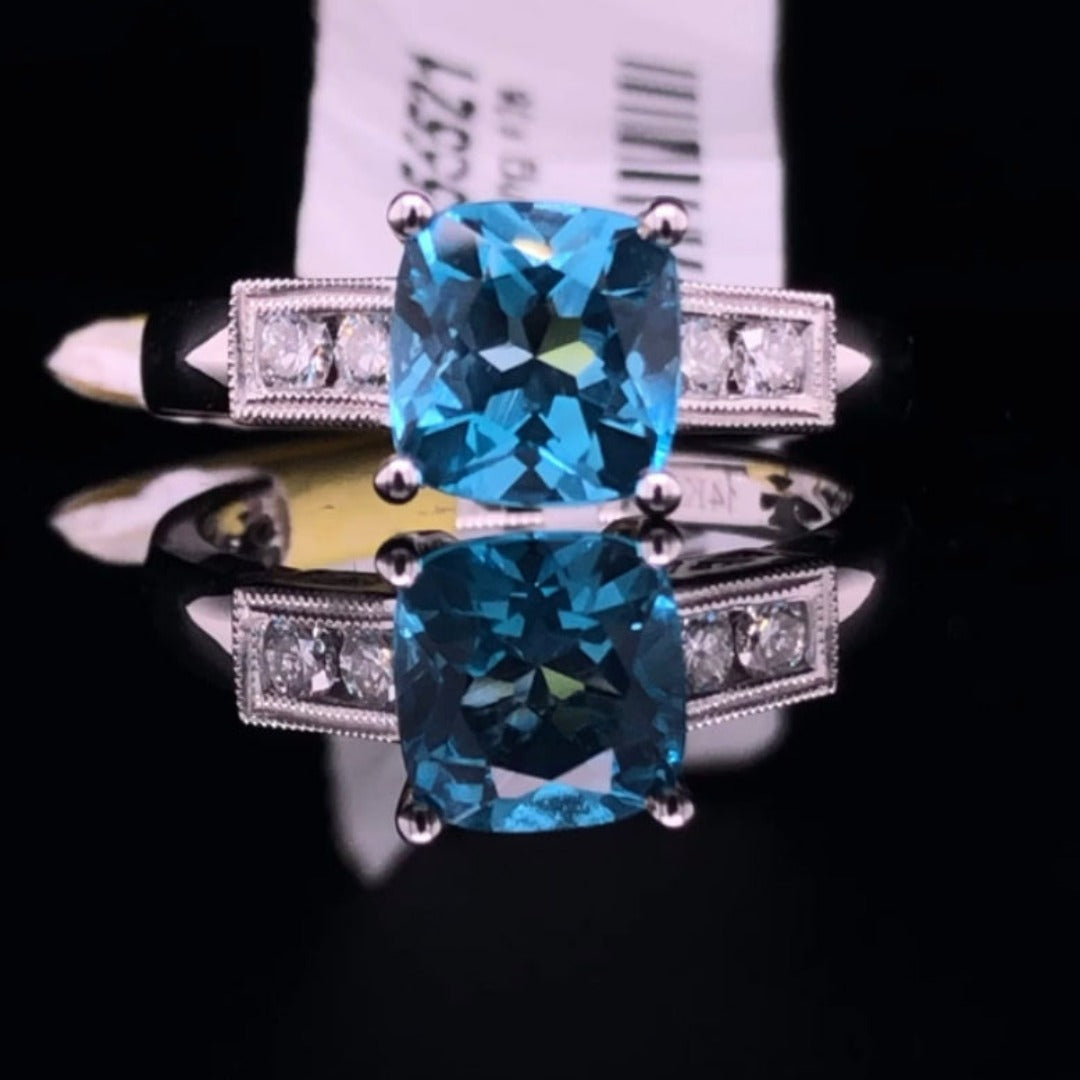 155521 - .15 ctw blue topaz and diamond ring