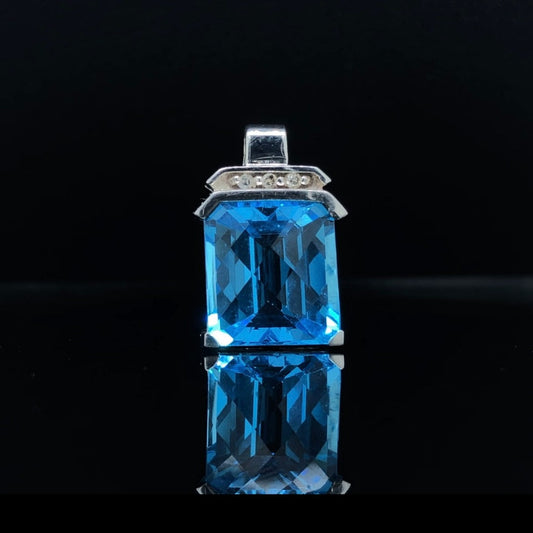 Blue topaz and diamond pendant