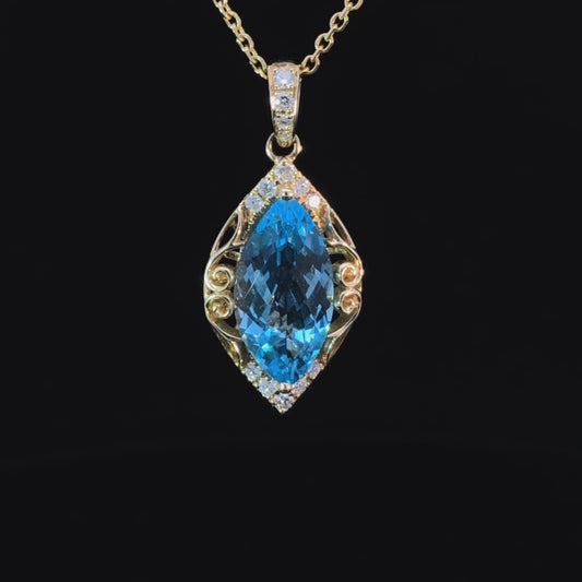 3.24 ctw blue topaz and diamond pendant