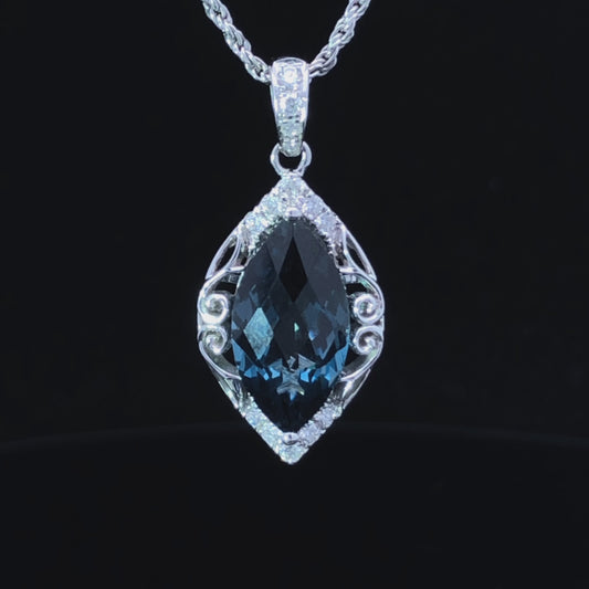 3.43 ctw blue topaz and diamond pendant