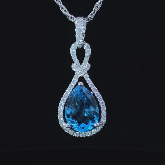 2.25 ctw diamond and blue topaz pendant